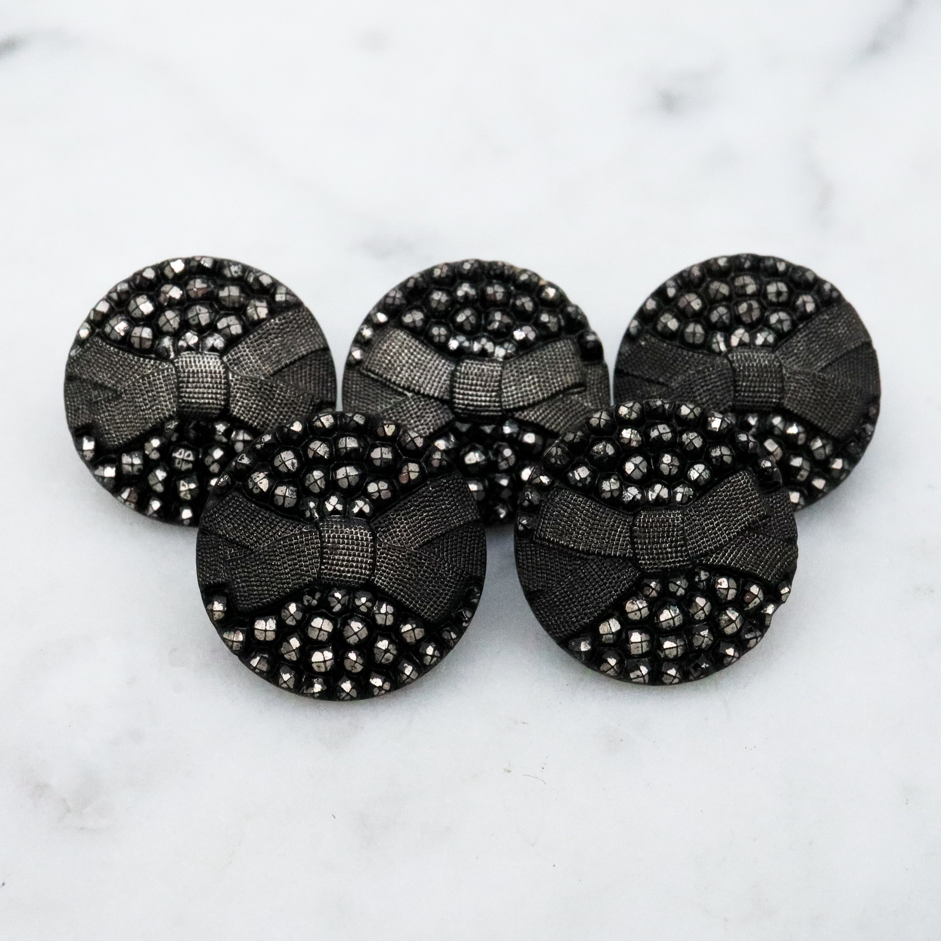 Set of 5 Antique Victorian jet black glass buttons w/silver painted rivets & bow